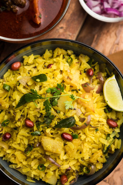 istock Aloo/Kanda Poha or Tarri Pohe with spicy chana masala/curry. selective focus 1093256048
