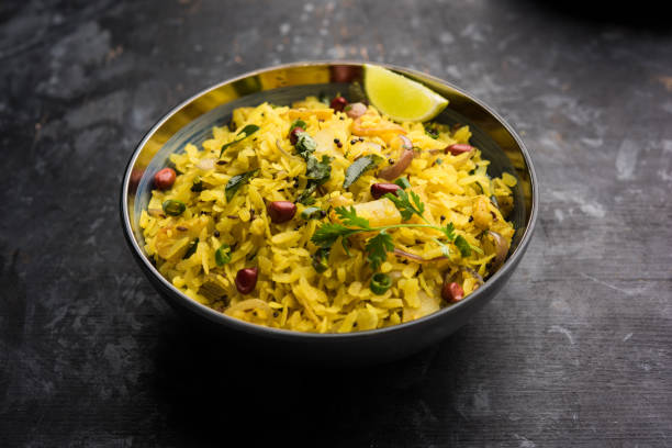 istock Aloo/Kanda Poha or Tarri Pohe with spicy chana masala/curry. selective focus 1093256368
