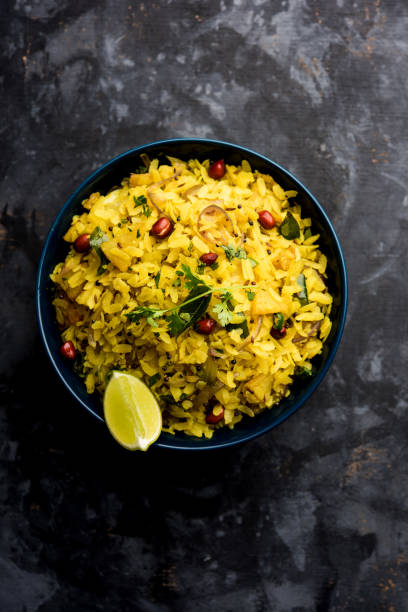istock Aloo/Kanda Poha or Tarri Pohe with spicy chana masala/curry. selective focus 1093257486