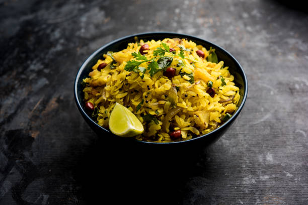 istock Aloo/Kanda Poha or Tarri Pohe with spicy chana masala/curry. selective focus 1093257580