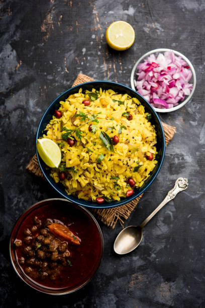 istock Aloo/Kanda Poha or Tarri Pohe with spicy chana masala/curry. selective focus 1093257926