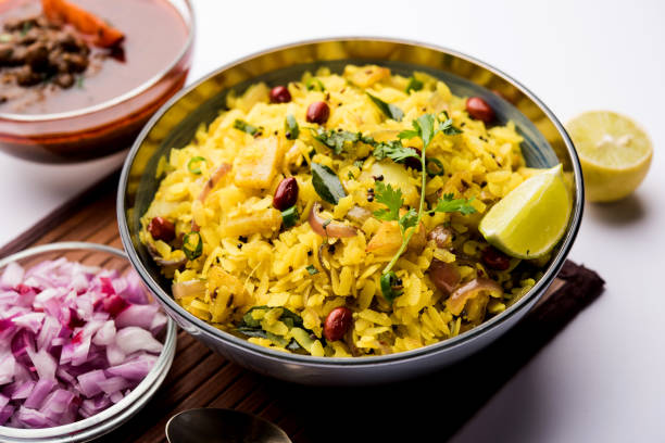 istock Aloo/Kanda Poha or Tarri Pohe with spicy chana masala/curry. selective focus 1093257994