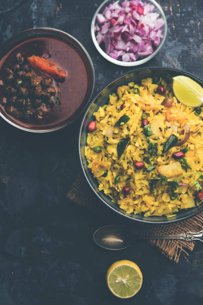 istock Aloo/Kanda Poha or Tarri Pohe with spicy chana masala/curry. selective focus 1093258372