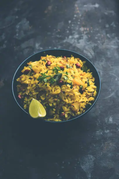 Photo of Aloo/Kanda Poha or Tarri Pohe with spicy chana masala/curry. selective focus