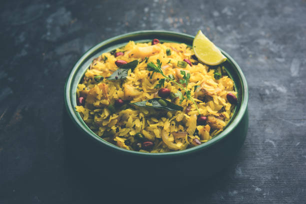 istock Aloo/Kanda Poha or Tarri Pohe with spicy chana masala/curry. selective focus 1093259734