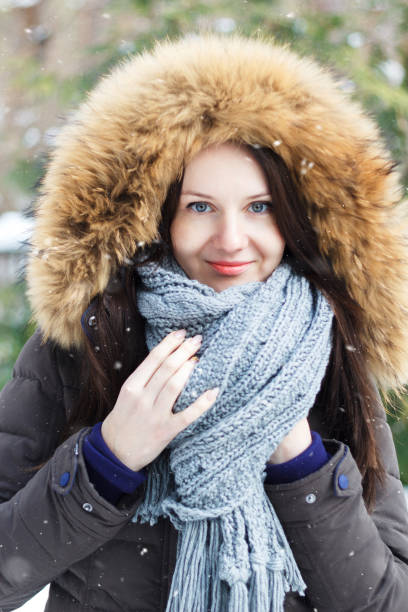 istock Young woman on a snow-covered yard. 1093259772