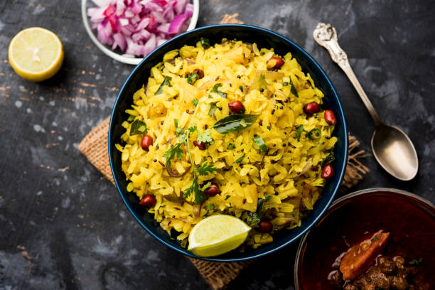 istock Aloo/Kanda Poha or Tarri Pohe with spicy chana masala/curry. selective focus 1093259996