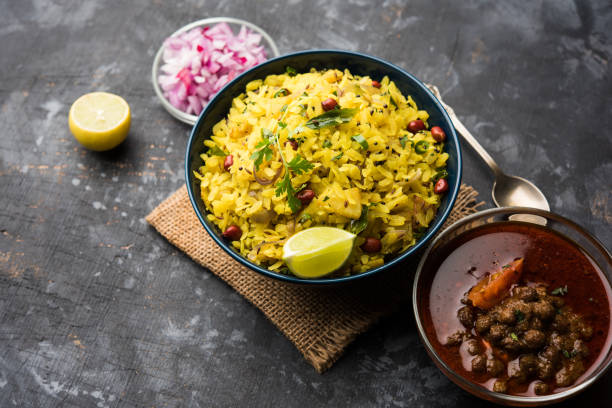 istock Aloo/Kanda Poha or Tarri Pohe with spicy chana masala/curry. selective focus 1093260132