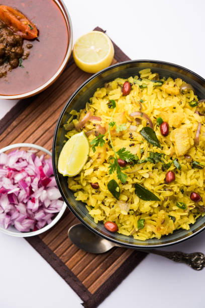 istock Aloo/Kanda Poha or Tarri Pohe with spicy chana masala/curry. selective focus 1093260426