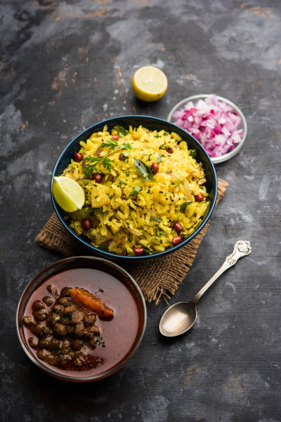 istock Aloo/Kanda Poha or Tarri Pohe with spicy chana masala/curry. selective focus 1093260544