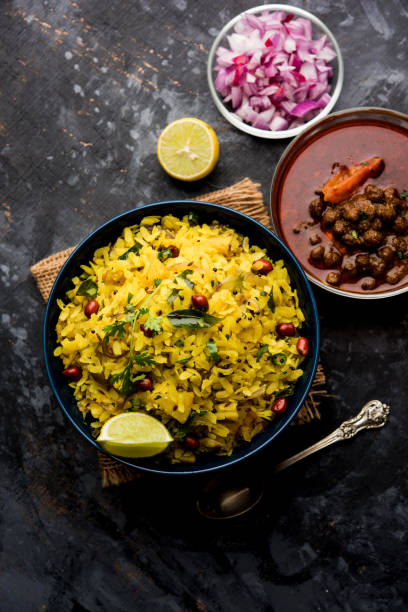 istock Aloo/Kanda Poha or Tarri Pohe with spicy chana masala/curry. selective focus 1093260594