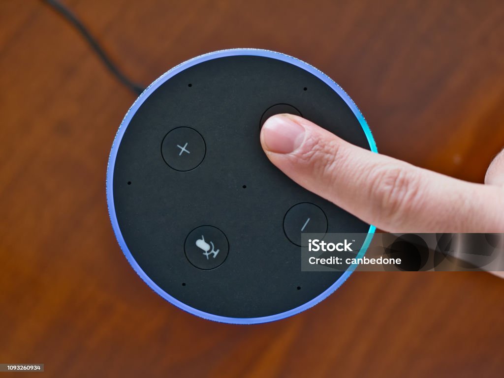 Smart speaker top view artificial intelligence assistant voice control blue ring Smart speaker top view artificial intelligence assistant voice control blue ring finger Home Automation Stock Photo