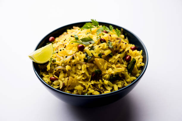 istock Aloo/Kanda Poha or Tarri Pohe with spicy chana masala/curry. selective focus 1093261012