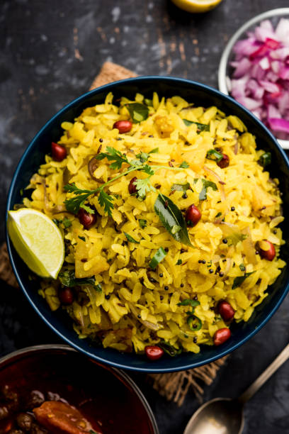 istock Aloo/Kanda Poha or Tarri Pohe with spicy chana masala/curry. selective focus 1093261070