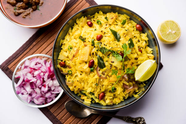 istock Aloo/Kanda Poha or Tarri Pohe with spicy chana masala/curry. selective focus 1093261090
