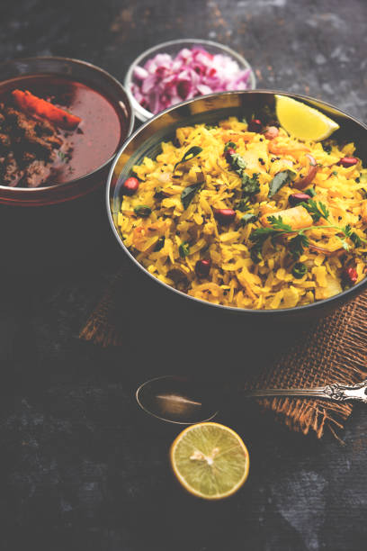 istock Aloo/Kanda Poha or Tarri Pohe with spicy chana masala/curry. selective focus 1093261180
