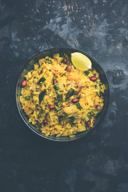 istock Aloo/Kanda Poha or Tarri Pohe with spicy chana masala/curry. selective focus 1093261226