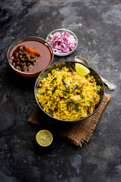 istock Aloo/Kanda Poha or Tarri Pohe with spicy chana masala/curry. selective focus 1093262654