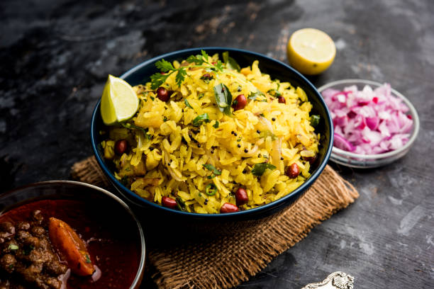 istock Aloo/Kanda Poha or Tarri Pohe with spicy chana masala/curry. selective focus 1093263248