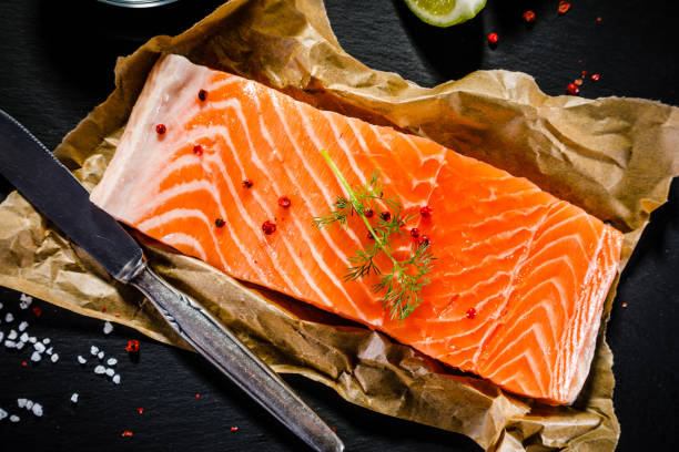 istock Fresh raw salmon steak on stone plate 1093263294