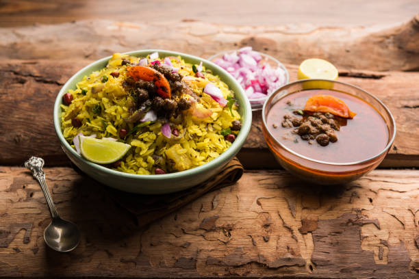 istock Aloo/Kanda Poha or Tarri Pohe with spicy chana masala/curry. selective focus 1093265170