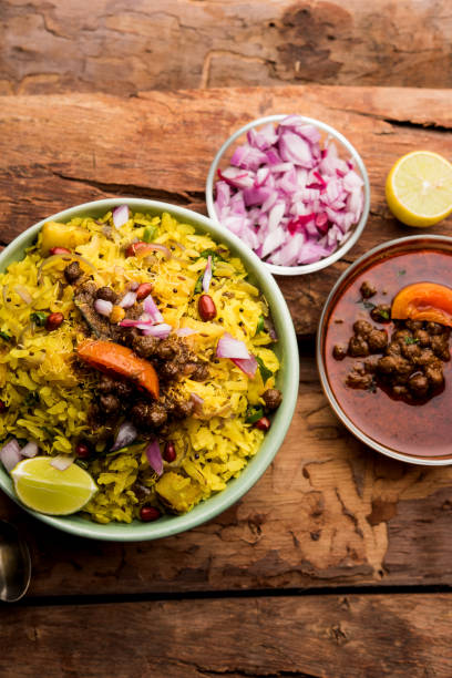 istock Aloo/Kanda Poha or Tarri Pohe with spicy chana masala/curry. selective focus 1093265194