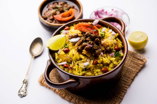 istock Aloo/Kanda Poha or Tarri Pohe with spicy chana masala/curry. selective focus 1093265310
