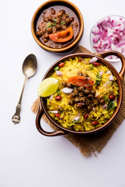 istock Aloo/Kanda Poha or Tarri Pohe with spicy chana masala/curry. selective focus 1093265714