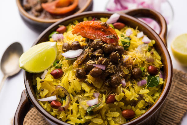 istock Aloo/Kanda Poha or Tarri Pohe with spicy chana masala/curry. selective focus 1093265736