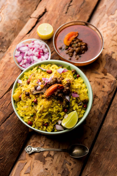 istock Aloo/Kanda Poha or Tarri Pohe with spicy chana masala/curry. selective focus 1093266034