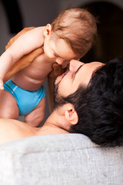 istock Dad makes his little baby laugh 1093271766