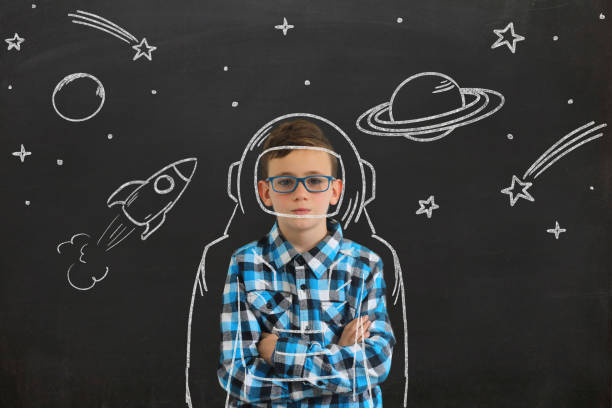 istock Young boy child think idea dreaming imagination space stars 1093272630
