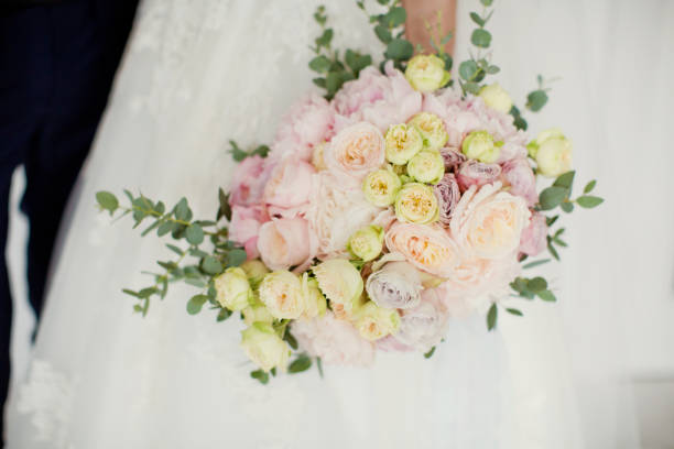 istock bride holding wedding bouquet 1093274296