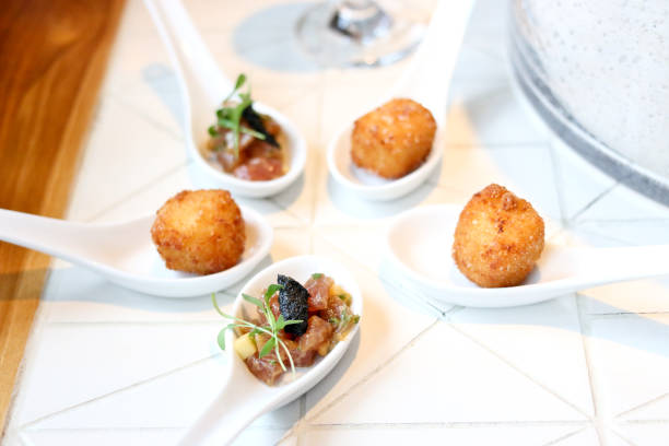istock fried cheese balls and sashimi tuna appetizer 1093280174