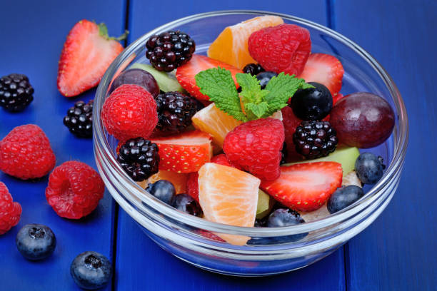 istock Delicious fruits salad in a bowl on table 1093282678