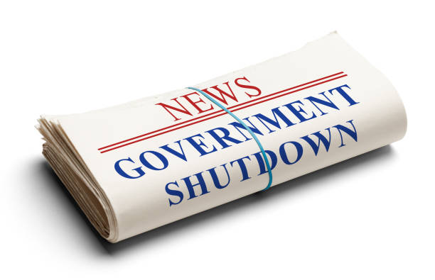 Government Shutdown Folded Newspaper With Headline Government Shutdown Isolated on White. government-shutdown stock pictures, royalty-free photos & images