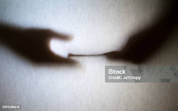 Silhouette Of Business Man Hands Giving Bribe Isolated On Grey Background Stock Photo - Download Image Now