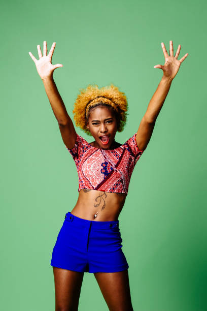 istock Young woman with both arms up 1093290266