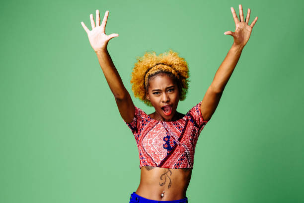 istock Young woman with both arms up 1093290274