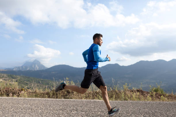 istock Sportsman running on asphalt road 1093290330