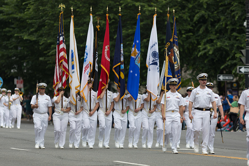 Washington, D.C., USA - May 28, 2018: The National Memorial Day Parade, United States Navy members marching down constitution avenue during the parade