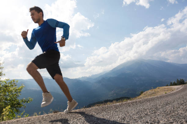 istock Sportsman running on asphalt road 1093290914
