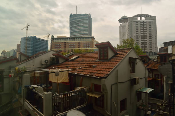 A view of modern high rise buildings through the alleyways of middle class residential apartments reveals that there is a wide degree of class separation in China, however the folks living in these building consider themselves fortunate