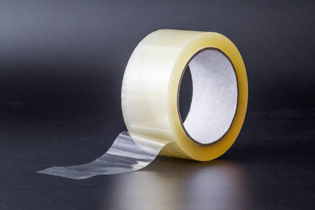 istock Scotch tape on black background 1093294686