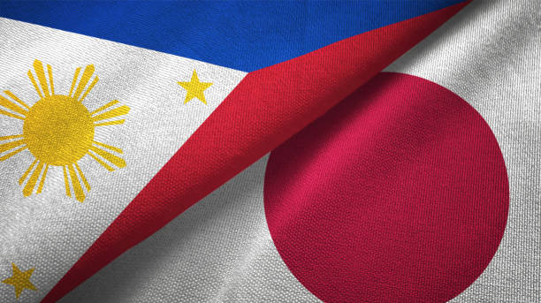 istock Japan and Philippines two flags together textile cloth fabric texture 1093304428