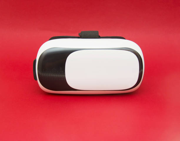 istock Virtual reality helmet isolated on red background 1093305094