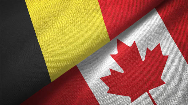 istock Canada and Belgium two flags together textile cloth fabric texture 1093307060