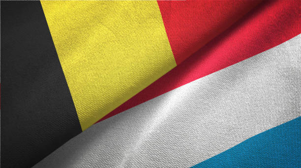 istock Luxembourg and Belgium two flags together textile cloth fabric texture 1093307640