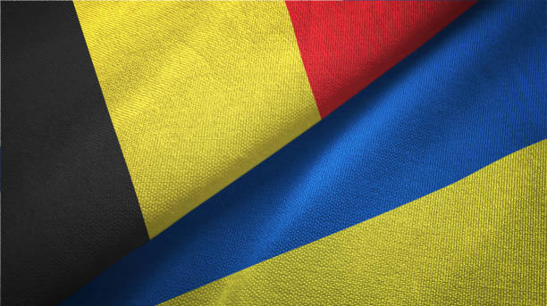 istock Ukraine and Belgium two flags together textile cloth fabric texture 1093309106