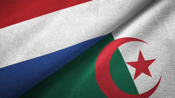 istock Algeria and Netherlands two flags together textile cloth fabric texture 1093316764